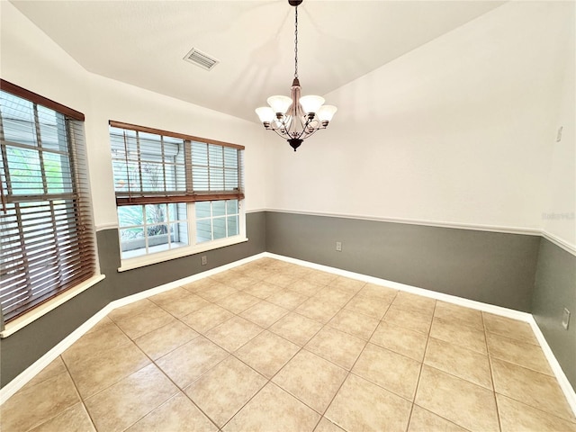 6522 Pimlico St, North Port, FL 34291 - spare room featuring a chandelier and tile patterned floors