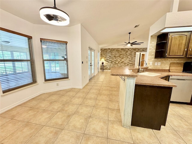 6522 Pimlico St, North Port, FL 34291 - kitchen with dishwasher, light tile patterned floors, open shelves, plenty of natural light, and lofted ceiling