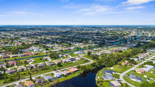 108 Albatross Rd, Rotonda West, FL 33947 - view of property location with a large body of water and nearby suburban area
