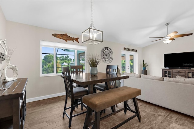 108 Albatross Rd, Rotonda West, FL 33947 - dining room featuring vaulted ceiling, wood finished floors, a chandelier, french doors, and ceiling fan