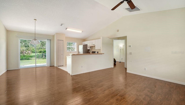 2403 Trianna St, North Port, FL 34291 - unfurnished living room featuring ceiling fan, lofted ceiling, and wood finished floors