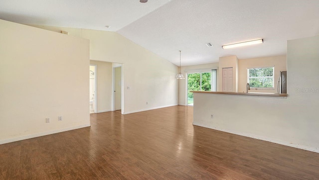 2403 Trianna St, North Port, FL 34291 - empty room featuring wood finished floors and vaulted ceiling