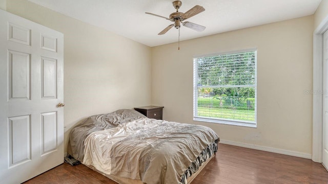 2403 Trianna St, North Port, FL 34291 - bedroom with multiple windows, wood finished floors, and a ceiling fan