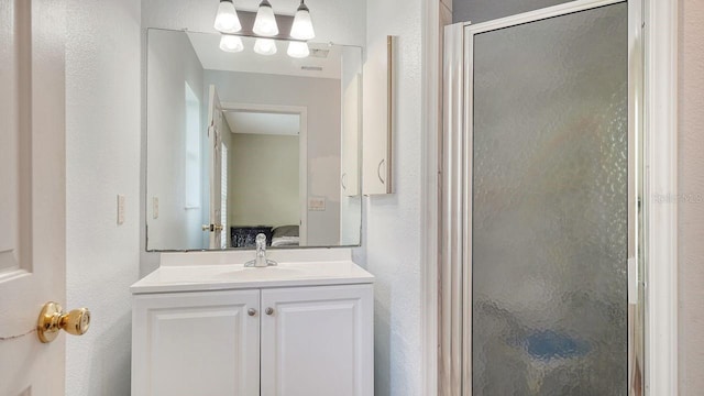 2403 Trianna St, North Port, FL 34291 - bathroom featuring a stall shower, vanity, and a textured wall