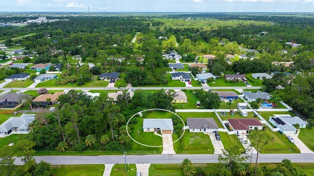 2403 Trianna St, North Port, FL 34291 - aerial perspective of suburban area featuring a heavily wooded area