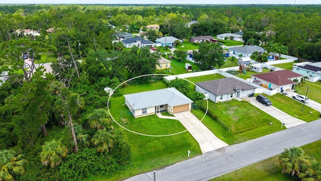 2403 Trianna St, North Port, FL 34291 - aerial view of residential area featuring a heavily wooded area