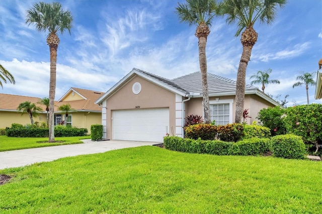 1429 Turnberry Dr, Venice, FL 34292 - view of front facade featuring a garage, concrete driveway, stucco siding, and a front yard