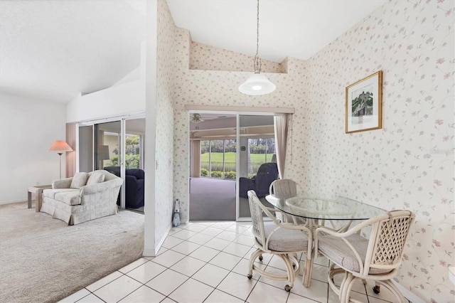 1429 Turnberry Dr, Venice, FL 34292 - dining area with vaulted ceiling, french doors, light carpet, light tile patterned floors, and wallpapered walls