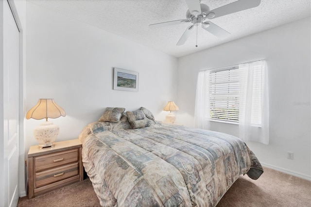 1429 Turnberry Dr, Venice, FL 34292 - bedroom featuring carpet floors, a textured ceiling, and ceiling fan