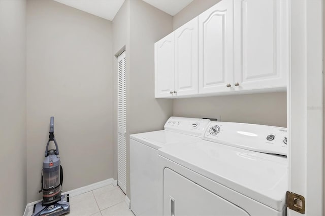 1429 Turnberry Dr, Venice, FL 34292 - laundry room with independent washer and dryer, cabinet space, and light tile patterned flooring