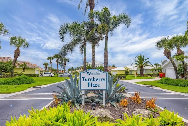 1429 Turnberry Dr, Venice, FL 34292 - community sign with driveway, a residential view, and a yard