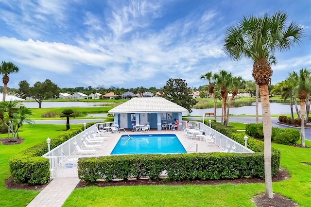 1429 Turnberry Dr, Venice, FL 34292 - community pool featuring a patio, a water view, an outbuilding, and an exterior structure