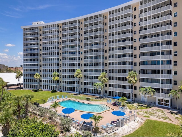 6300 Midnight Pass Rd Unit 809, Sarasota, FL 34242 - view of apartment building / complex featuring a community pool