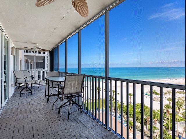 6300 Midnight Pass Rd Unit 809, Sarasota, FL 34242 - sunroom with a ceiling fan and view of water and beach