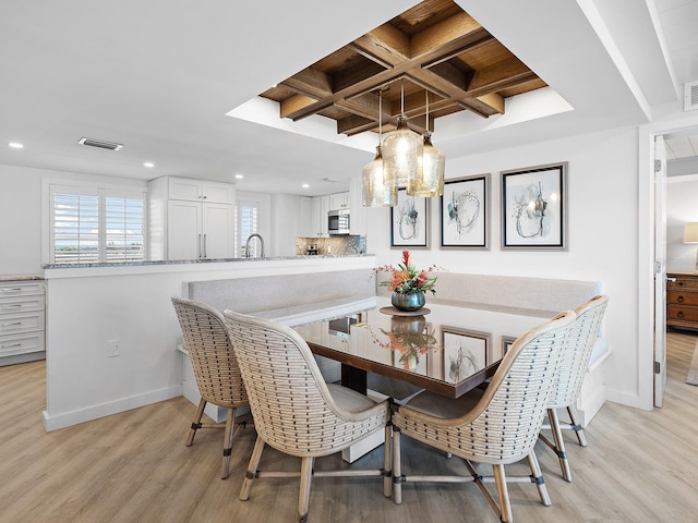 6300 Midnight Pass Rd Unit 809, Sarasota, FL 34242 - dining space featuring light wood finished floors, recessed lighting, beam ceiling, and coffered ceiling