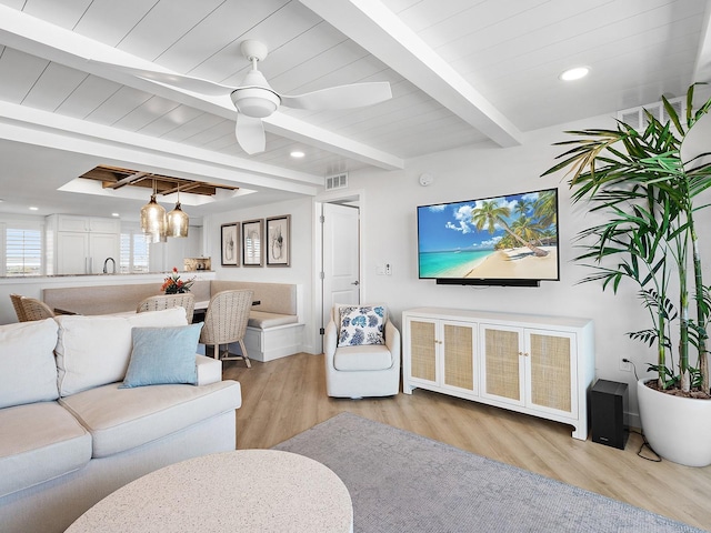 6300 Midnight Pass Rd Unit 809, Sarasota, FL 34242 - living area featuring wood finished floors, beamed ceiling, a ceiling fan, recessed lighting, and a chandelier