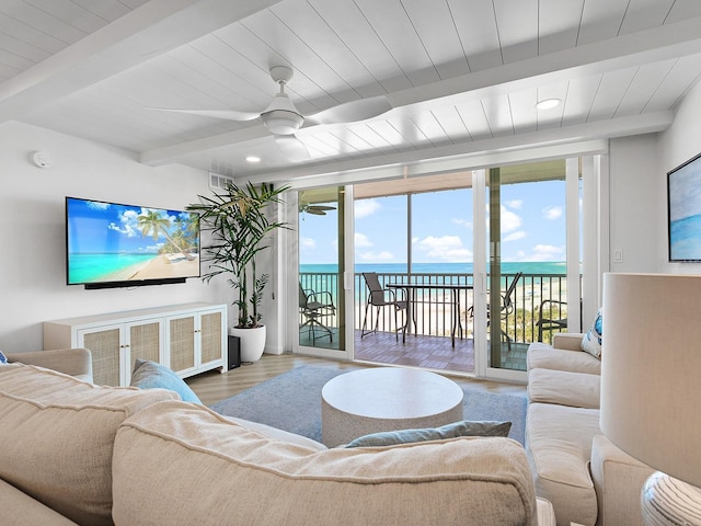 6300 Midnight Pass Rd Unit 809, Sarasota, FL 34242 - living area with a ceiling fan, a water view, wood finished floors, recessed lighting, and a wood ceiling with exposed beams