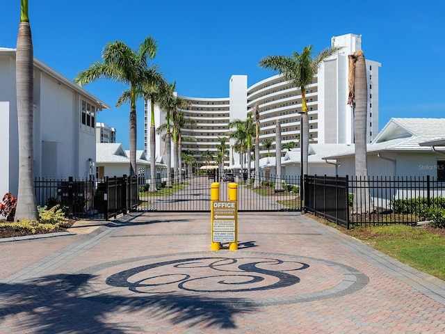 6300 Midnight Pass Rd Unit 809, Sarasota, FL 34242 - view of road featuring a gated entry, a gate, and curbs