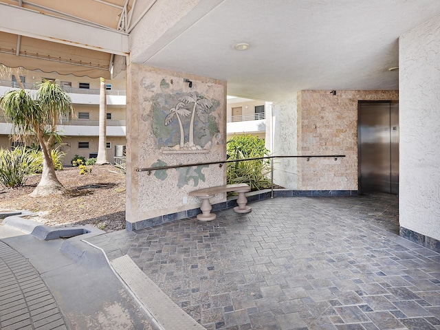 6300 Midnight Pass Rd Unit 809, Sarasota, FL 34242 - view of patio / terrace with elevator