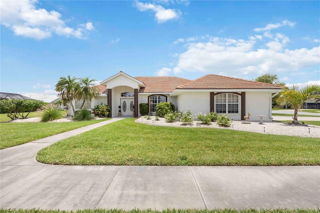 5028 Greenway Ct, North Port, FL 34287 - single story home featuring stucco siding, a front yard, and a tiled roof
