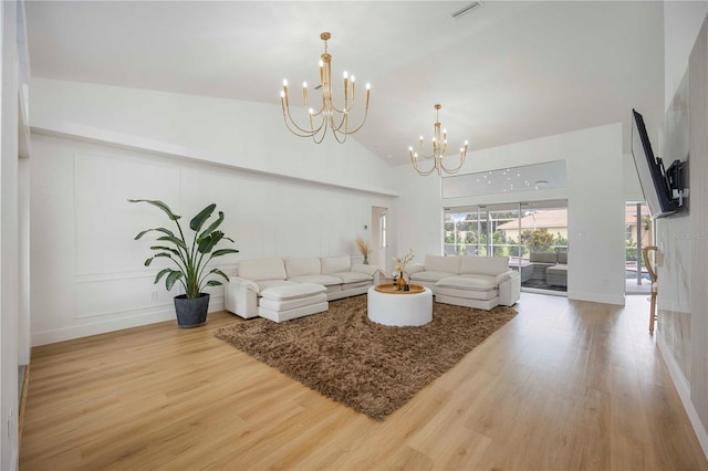 5028 Greenway Ct, North Port, FL 34287 - living room featuring a chandelier, high vaulted ceiling, and wood finished floors