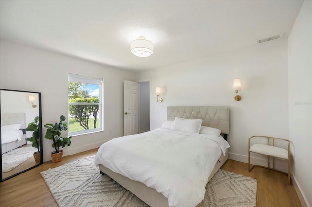 5028 Greenway Ct, North Port, FL 34287 - bedroom featuring baseboards and wood finished floors