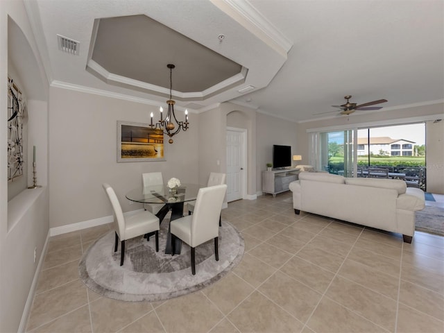 141 Bella Vista Ter Unit 34B, North Venice, FL 34275 - dining area with a chandelier, light tile patterned floors, a raised ceiling, ornamental molding, and a ceiling fan