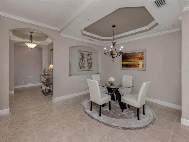141 Bella Vista Ter Unit 34B, North Venice, FL 34275 - dining room featuring light tile patterned floors, a chandelier, arched walkways, crown molding, and a tray ceiling