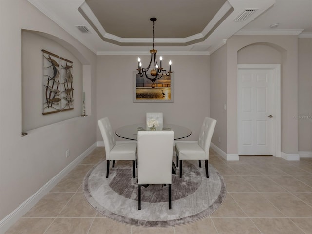 141 Bella Vista Ter Unit 34B, North Venice, FL 34275 - dining area featuring a chandelier, a raised ceiling, light tile patterned floors, and crown molding
