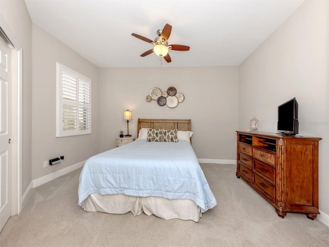 141 Bella Vista Ter Unit 34B, North Venice, FL 34275 - bedroom featuring light colored carpet and ceiling fan