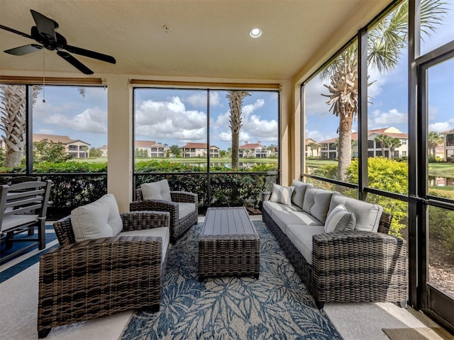 141 Bella Vista Ter Unit 34B, North Venice, FL 34275 - sunroom / solarium featuring outdoor lounge area, a ceiling fan, and a residential view