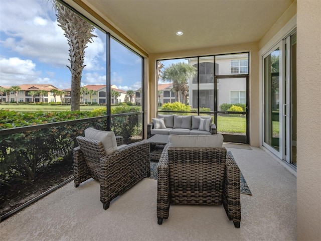 141 Bella Vista Ter Unit 34B, North Venice, FL 34275 - sunroom with healthy amount of natural light, a residential view, and an outdoor hangout area