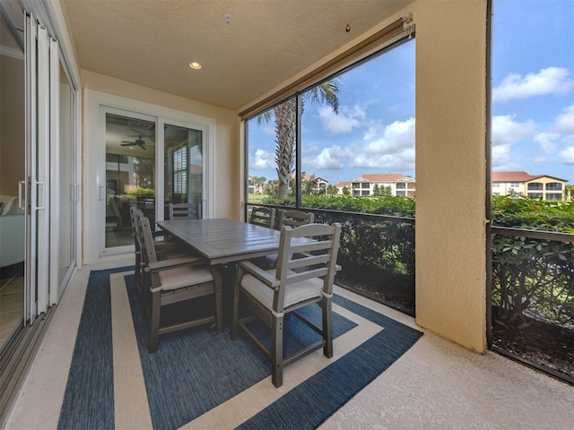141 Bella Vista Ter Unit 34B, North Venice, FL 34275 - sunroom / solarium with a ceiling fan, outdoor dining area, and healthy amount of natural light