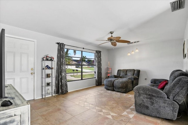 18671 Macgill Ave, Port Charlotte, FL 33948 - living room with a ceiling fan and light tile patterned floors