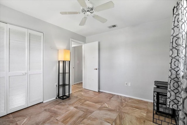18671 Macgill Ave, Port Charlotte, FL 33948 - unfurnished bedroom featuring a closet and ceiling fan