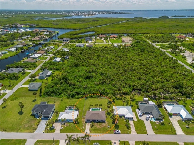 18671 Macgill Ave, Port Charlotte, FL 33948 - aerial perspective of suburban area featuring a large body of water