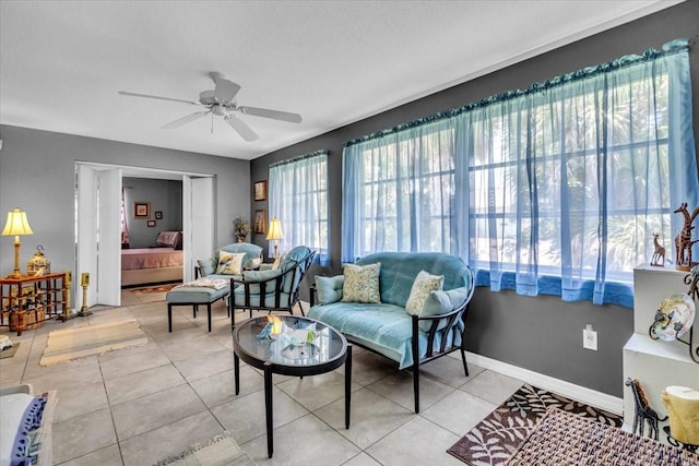 8651 Ellesmere Ct, North Port, FL 34287 - living area with ceiling fan and tile patterned flooring