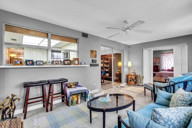 8651 Ellesmere Ct, North Port, FL 34287 - living room featuring ceiling fan and tile patterned flooring