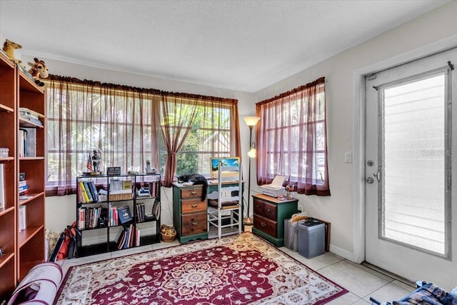 8651 Ellesmere Ct, North Port, FL 34287 - office area featuring a textured ceiling and tile patterned flooring