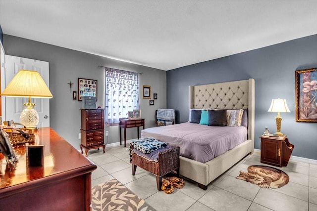 8651 Ellesmere Ct, North Port, FL 34287 - bedroom with light tile patterned floors and baseboards