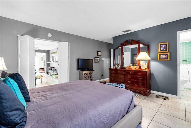 8651 Ellesmere Ct, North Port, FL 34287 - bedroom featuring baseboards and light tile patterned floors
