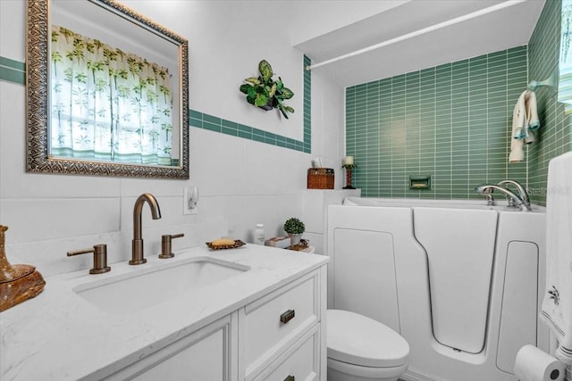 8651 Ellesmere Ct, North Port, FL 34287 - bathroom featuring tile walls, a garden tub, vanity, and decorative backsplash