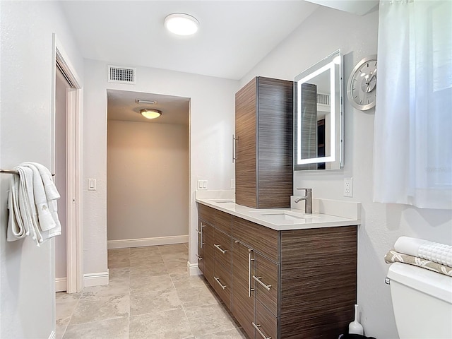 1335 Rock Dove Ct Unit 111, Punta Gorda, FL 33950 - full bathroom featuring double vanity and toilet
