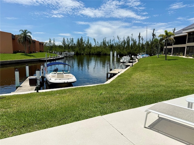 1335 Rock Dove Ct Unit 111, Punta Gorda, FL 33950 - dock area with a water view and a yard