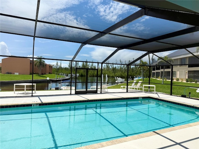 1335 Rock Dove Ct Unit 111, Punta Gorda, FL 33950 - community pool with a water view, a patio, a yard, and glass enclosure