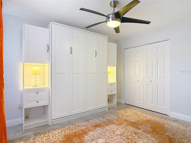 1335 Rock Dove Ct Unit 111, Punta Gorda, FL 33950 - unfurnished bedroom with concrete floors, ceiling fan, and multiple closets