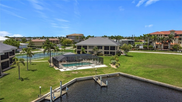 1335 Rock Dove Ct Unit 111, Punta Gorda, FL 33950 - back of property featuring an outdoor pool, a lawn, a water view, and a residential view