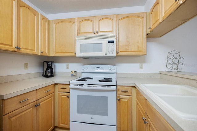 752 White Pine Tree Rd Unit 108, Venice, FL 34285 - kitchen featuring white appliances, light brown cabinetry, and light countertops