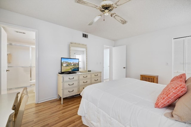 752 White Pine Tree Rd Unit 108, Venice, FL 34285 - bedroom with light wood-type flooring, ensuite bathroom, and a ceiling fan