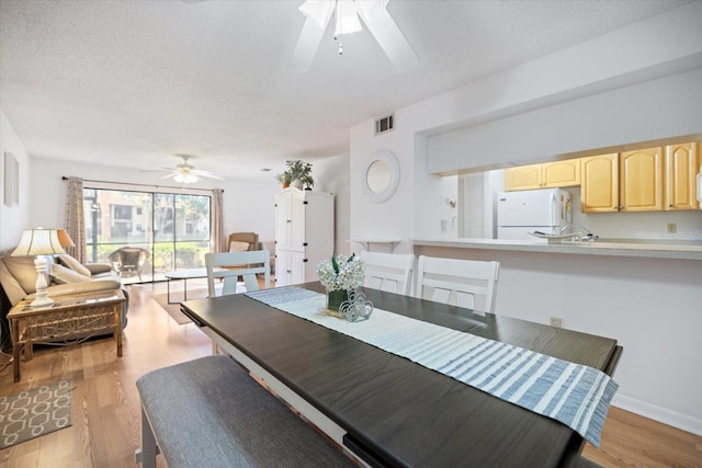 752 White Pine Tree Rd Unit 108, Venice, FL 34285 - dining space with a ceiling fan and light wood-type flooring